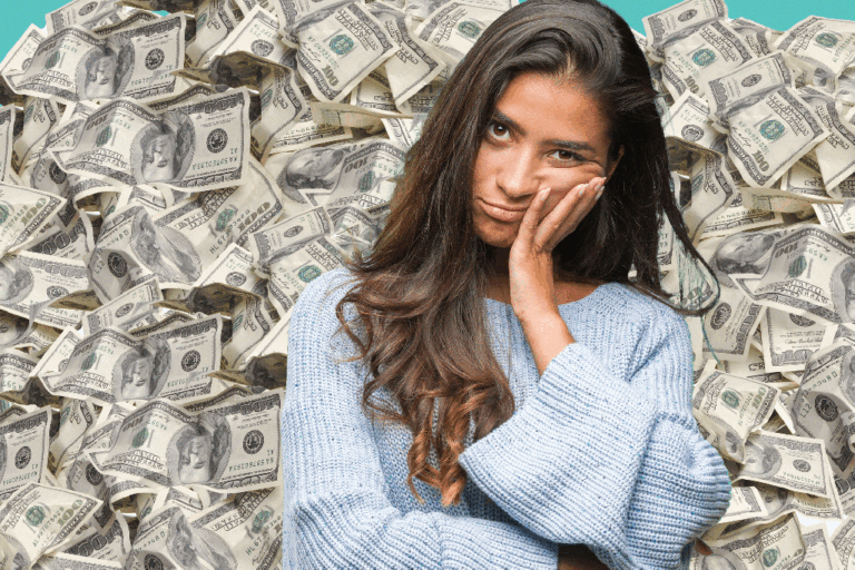 Woman looking stressed surrounded by cash